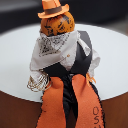 Pumpkin decorated as Pistol Pete sitting on a table