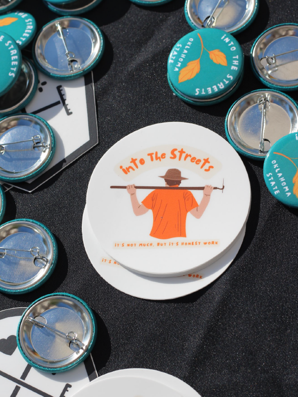 Into the Streets promotional stickers and buttons Into the Streets promotional stickers and buttons